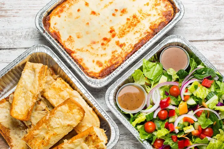 meat lasagna family dinner pack highlighting Meal Village's ready to eat family dinner delivery services