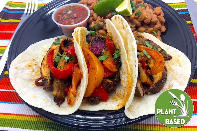Plant based wild mushroom fajitas on flour tortillas with pinto beans and fire roasted salsa.