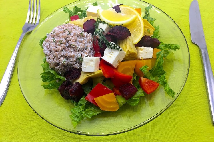 Mediterranean chopped salad of Israeli couscous and romaine with grilled chicken, artichoke hearts and beets.