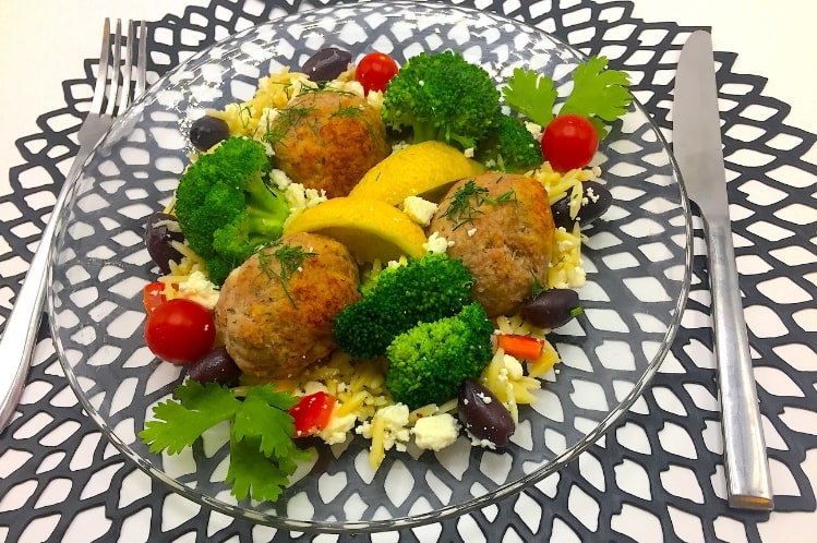 Greek turkey meatballs in lemon dill sauce over orzo pasta with broccoli and feta cheese.