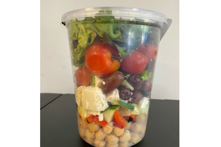 Mediterranean chickpea salad with roasted red pepper, red onion, cucumber, feta, kalamata olives and tomatoes.