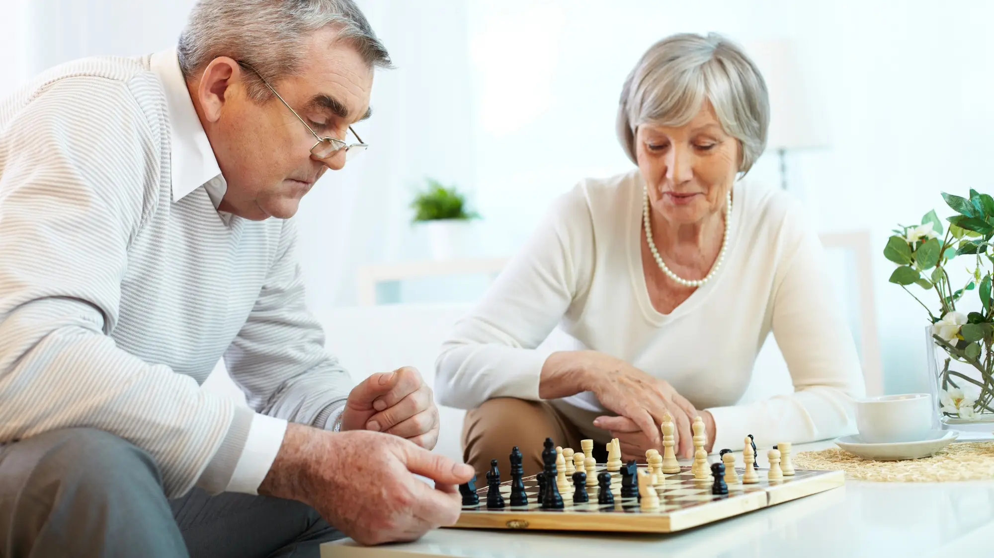 elderly-couple-playing-chess-at-home-for-brain-exercise