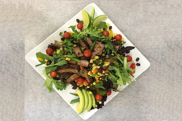 latin steak salad with corn salsa indicating Meal Village's fresh salad delivery services in Chicago